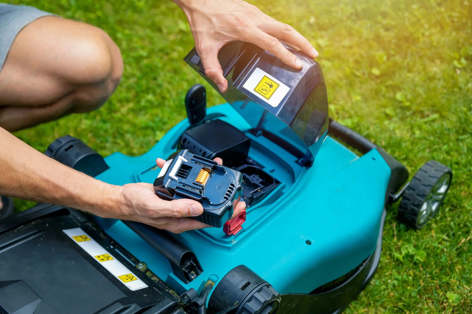 Lawn Mower Battery Pack being replaced
